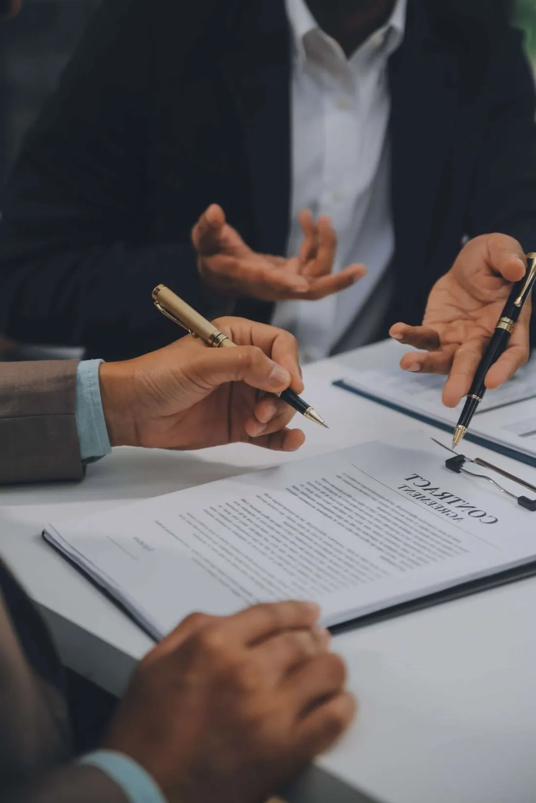 Shareholders reviewing and signing IFZA registration documents